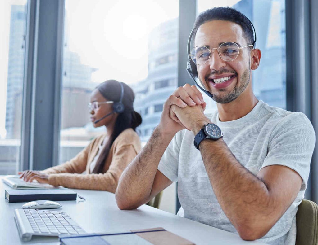 Shot of male and female colleagues working together in their office at a call center.